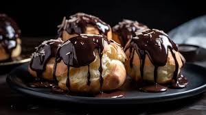 Josephine signature dishes Profiterole with dark chocolate sauce.